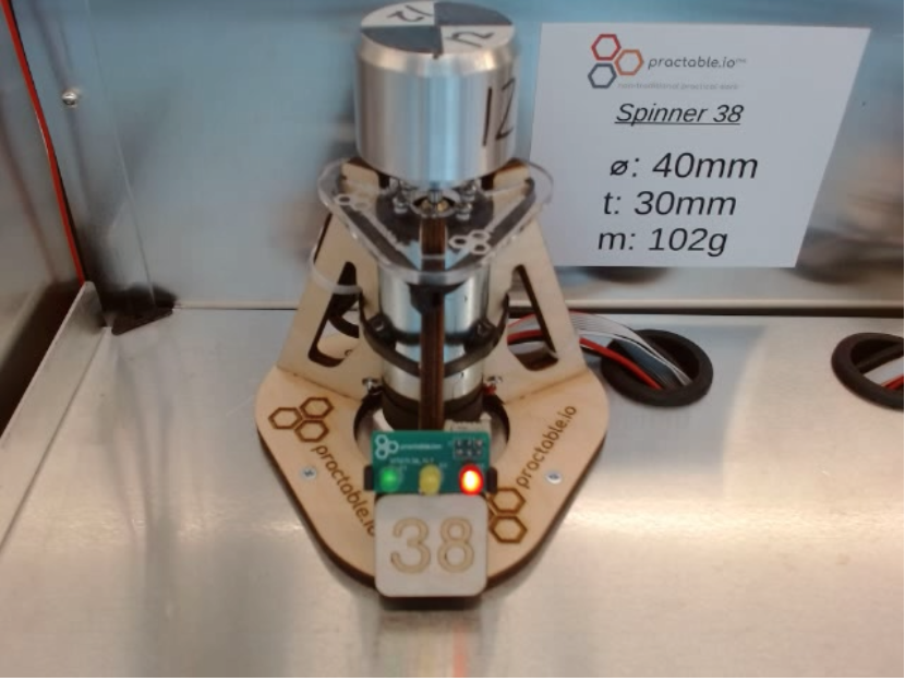 Spinner hardware using Amax motor in tri-pod mount