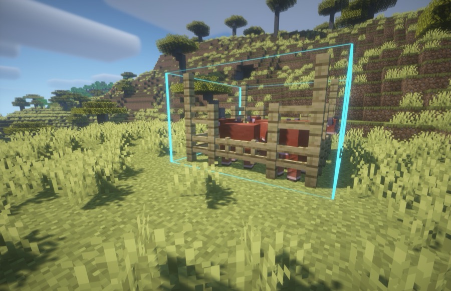 A coloured sound-zone outline enclosing a Minecraft animal pen