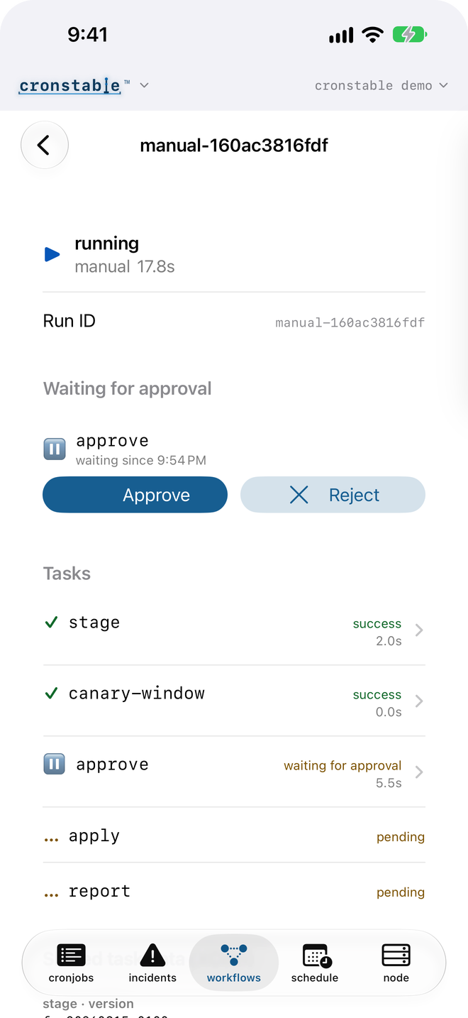 A workflow run in light mode, waiting at an approval gate with Approve and Reject buttons above its task list