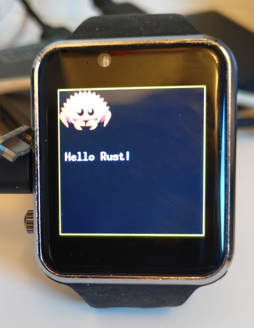 Photo of the watch displaying "Hello Rust!"