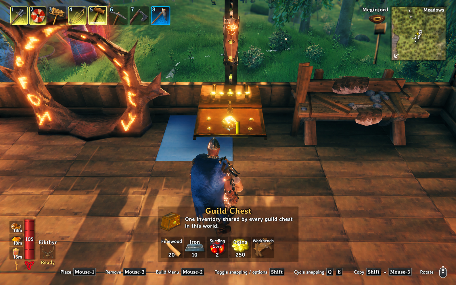 Guild Chest placement preview beside a portal and workbench, with all four material costs visible