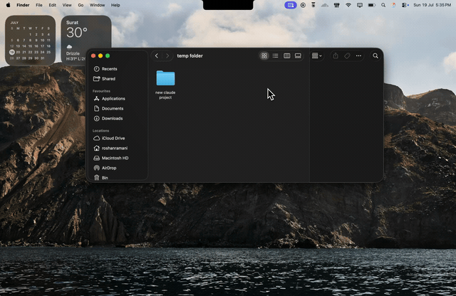Dragging a folder onto the notch to start a Claude Code session