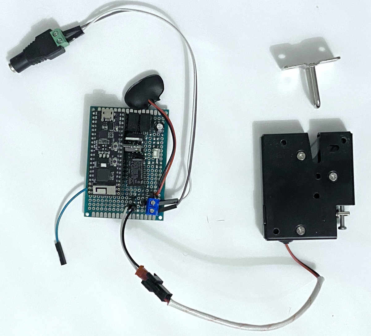 Image of the POW Lock showing the ESP32, power conditioning electronics and relay, as well as the electronic latch