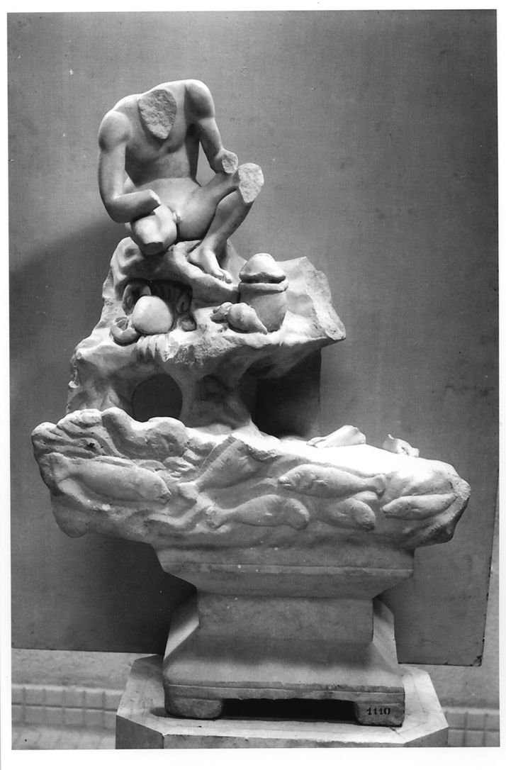 Photo of the sculpture of a Fisherman on a rock