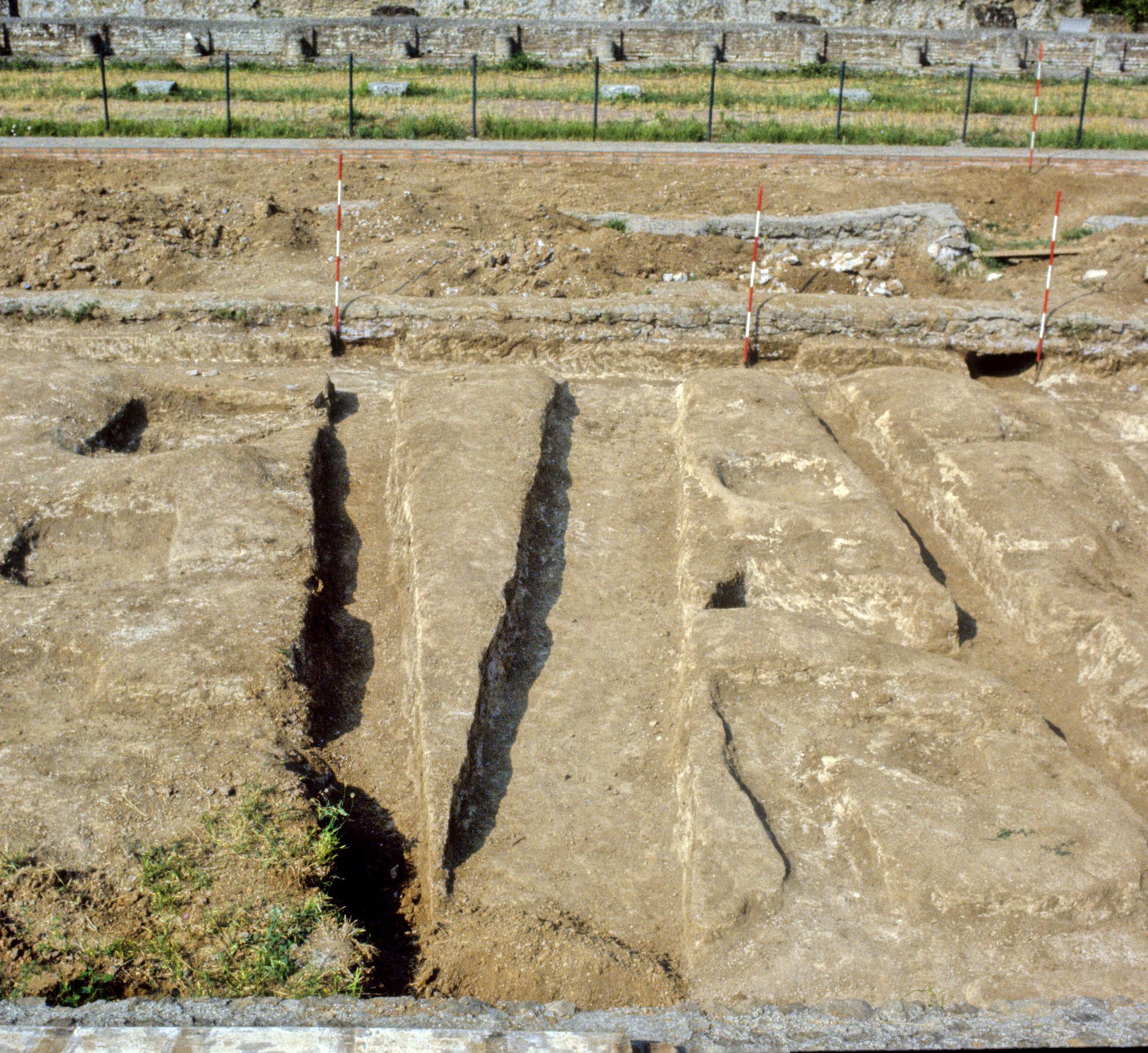 Western view of the excavations of the Piazza d'Oro garden at Hadrian's Villa, showing the low rectangular cuts in the tufa through which irrigation seeped into the garden canals