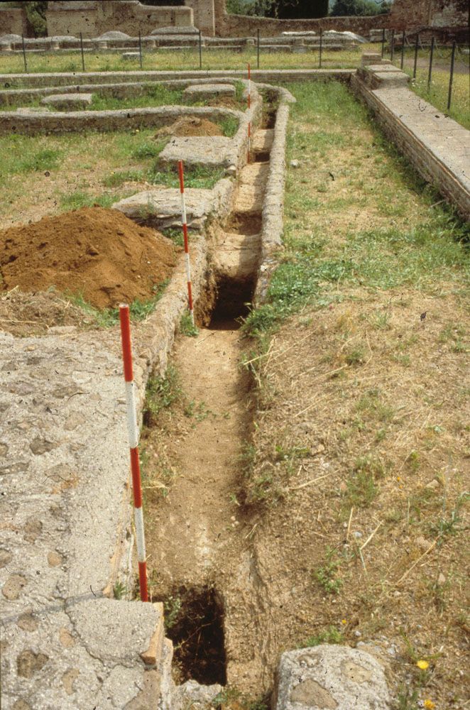 Photograph of eastern irrigation canal of the Piazza d'Oro garden Hadrian's Villa, showing the many little pits excavated in its bottom