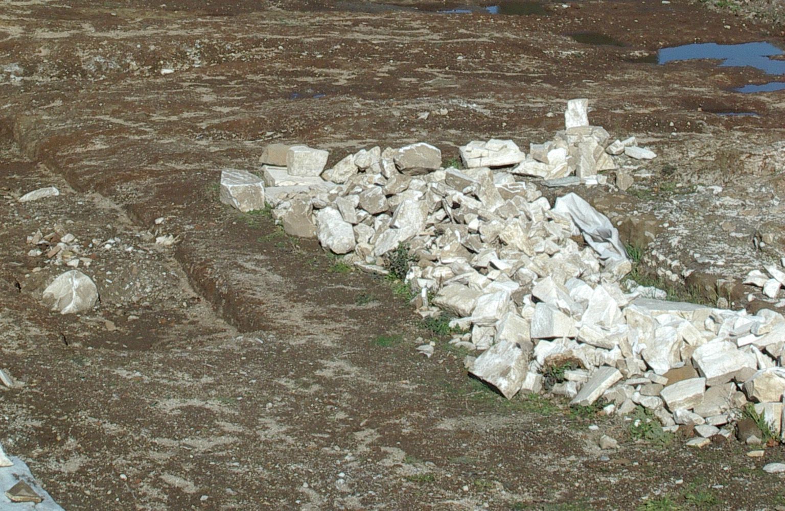 Photograph of marble bricks and fragments of statues and architectural moldings taken over centuries from Hadrian's Villa by the local people to be used in their buildings or burned in their kilns to make lime