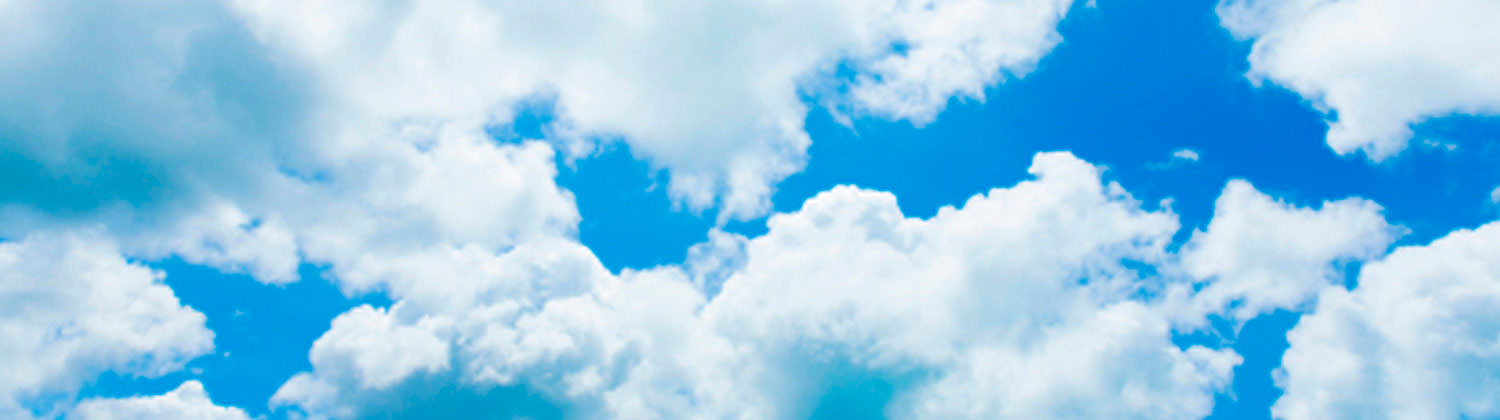 Bright blue sky with fluffy white clouds