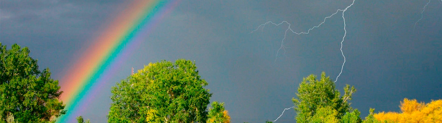 Darks sky, lightening and a rainbow