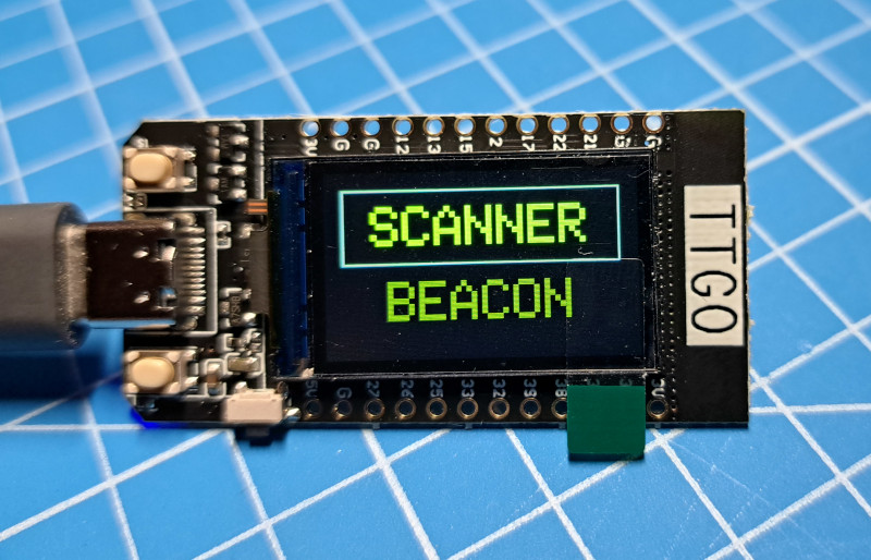 Image of a TTGO with the menu screen showing SCANNER band BEACON options.