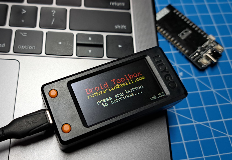 Image of a LilyGo T-Display-S3, inside a LilyGo T-Display-S3 case, running Droid Toolbox=