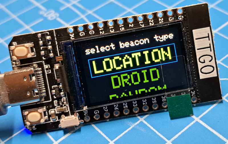 Image of a TTGO showing a 'select beacon type' menu on the display.