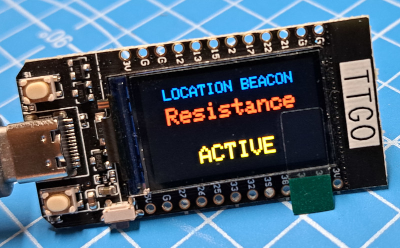 Image of a TTGO showing a 'select a beacon' menu on the display.