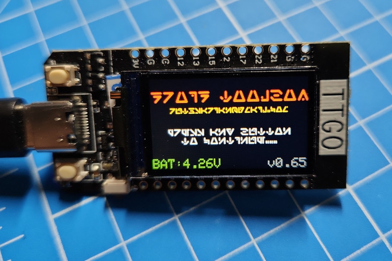 Image of a TTGO with the Droid Toolbox splash screen in an Aurebesh font.