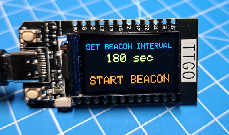 Image of a TTGO showing a 'set beacon interval' option on the display.