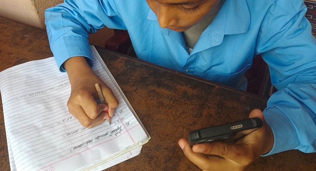 Milan studying Class 10 Science with Guru