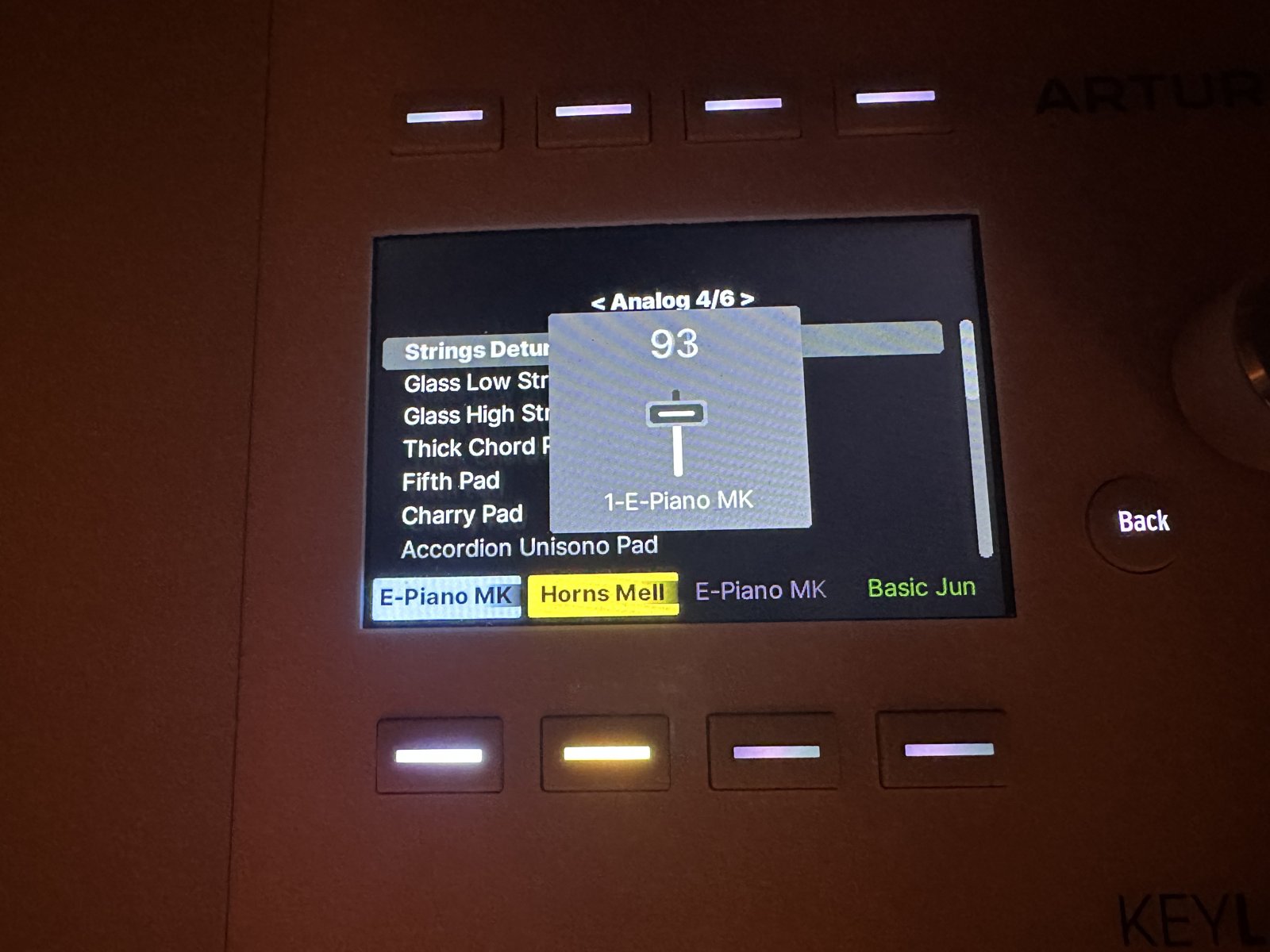 A fader readout on the KeyLab screen: value 93 and the track name, over an open preset list