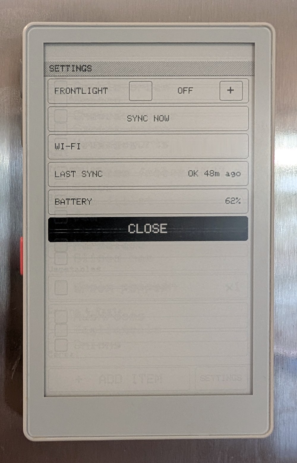 The PaperMono settings screen: frontlight, sync now, Wi-Fi, last sync and battery