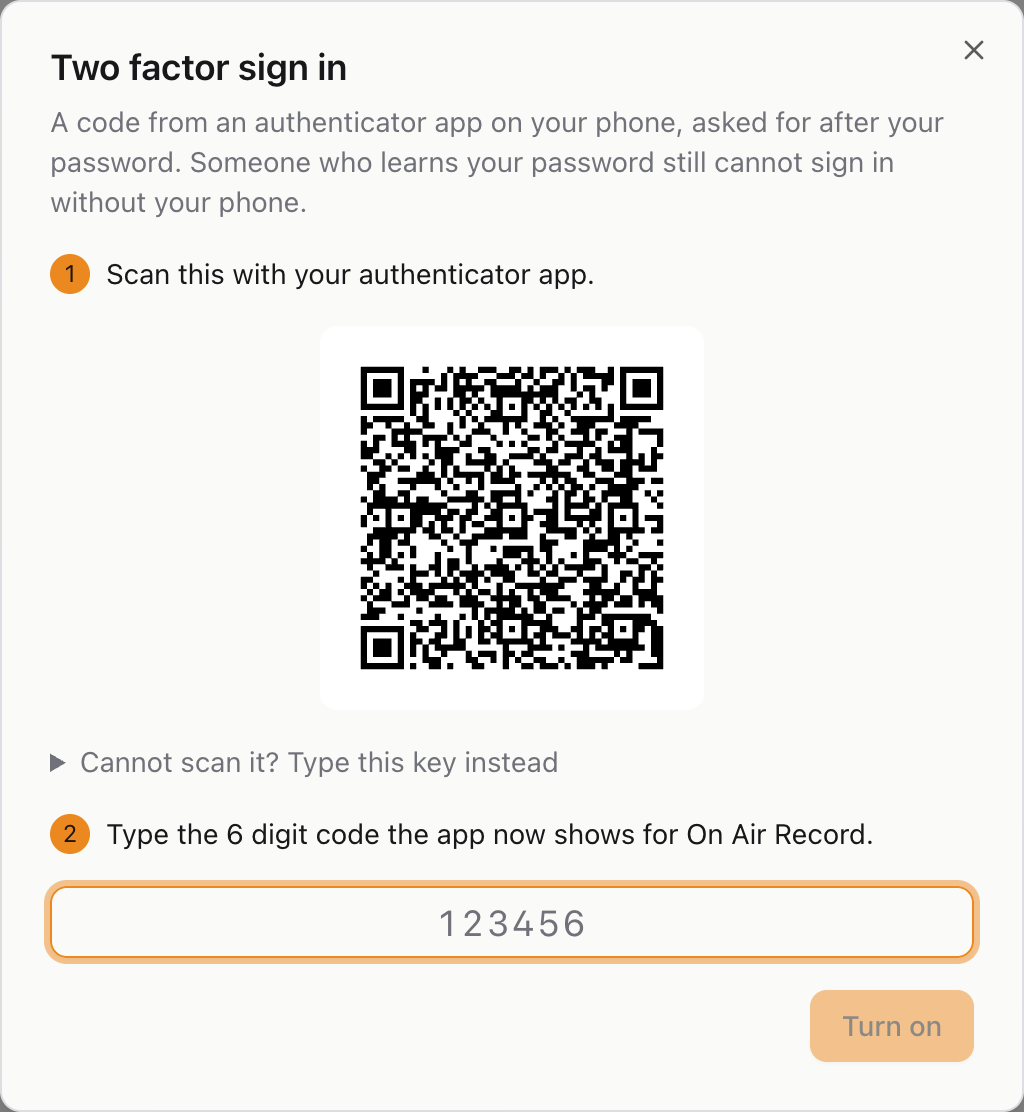 Setting up two factor sign in: a QR code to scan, and a box for the code the app then shows