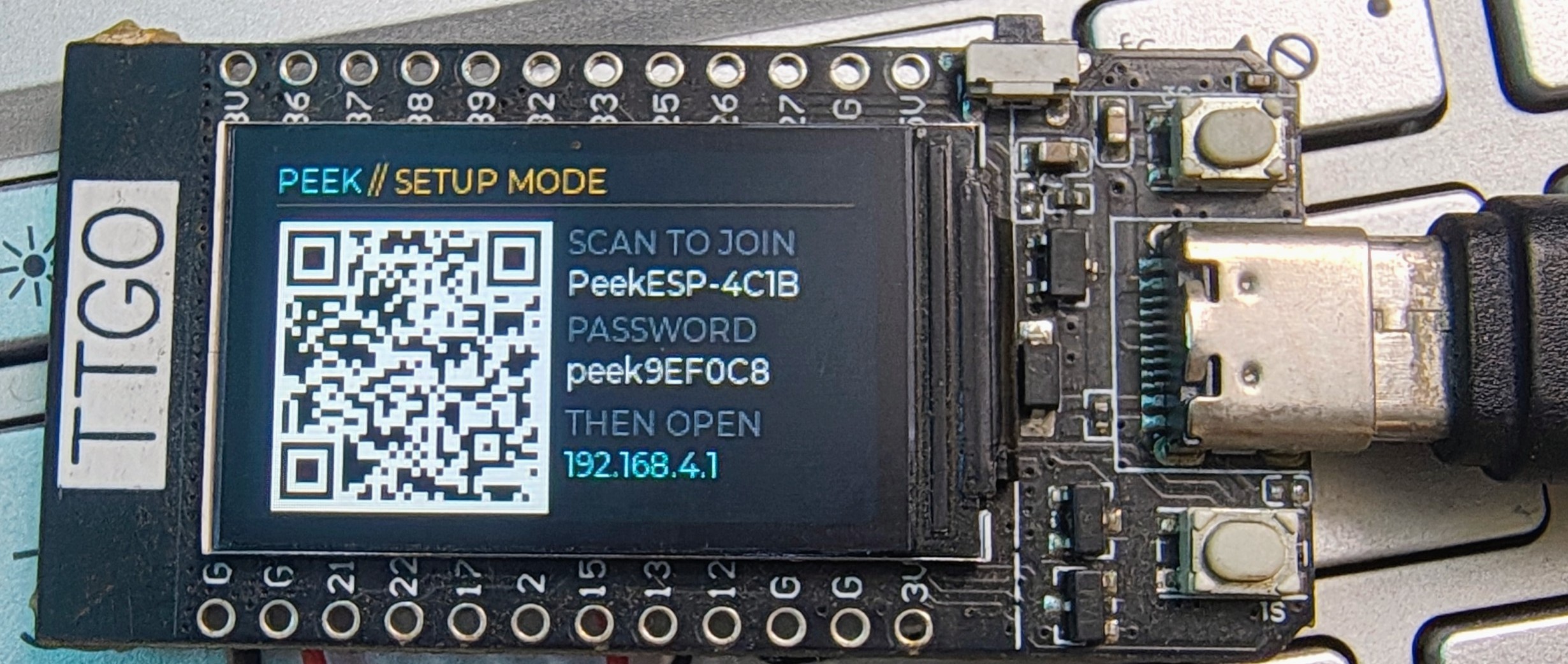 Setup mode showing a QR code, the access point name and its password