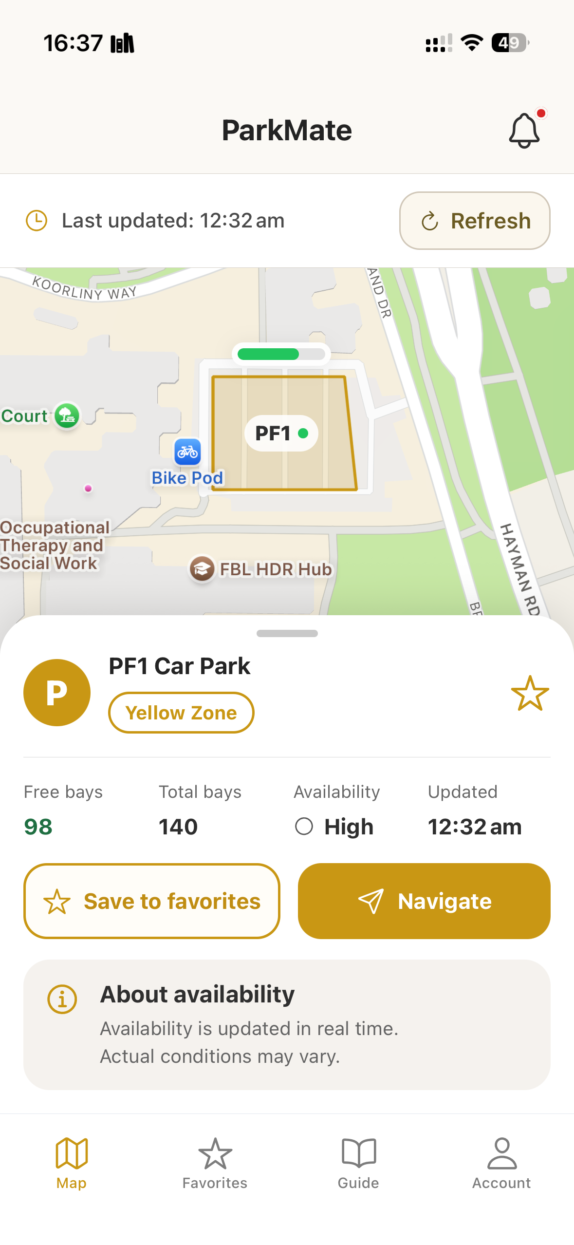 ParkMate campus map with a selected parking lot, available bays, and navigation controls