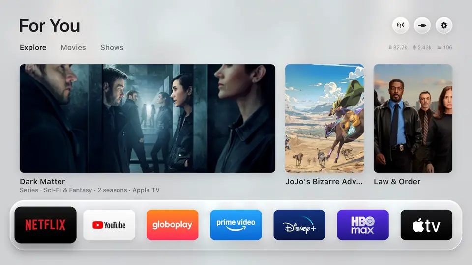 The Free My TV home screen: a glass shelf of apps, trending picks, and a drawer with the weather and crypto prices