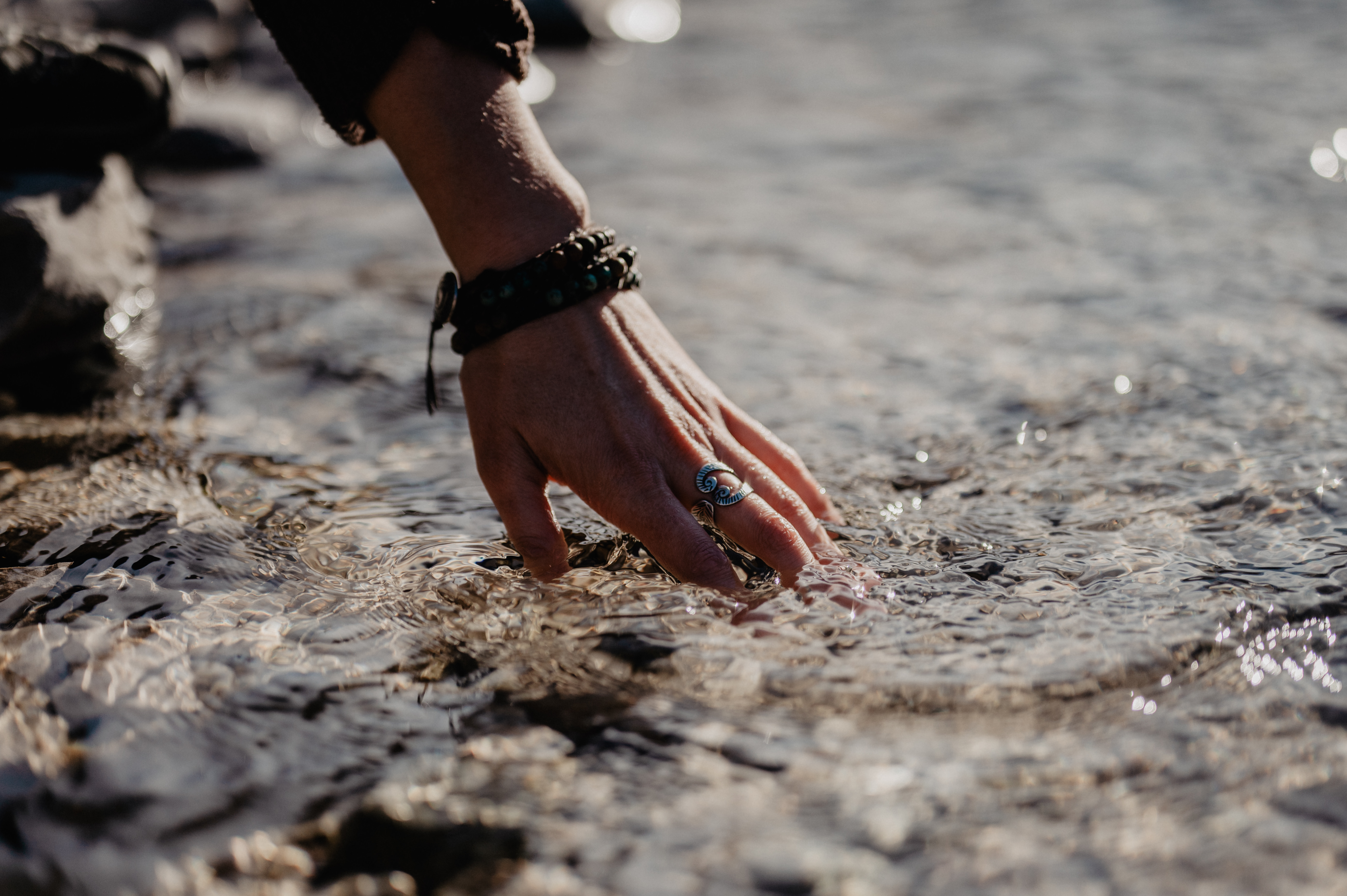 Hand touching water