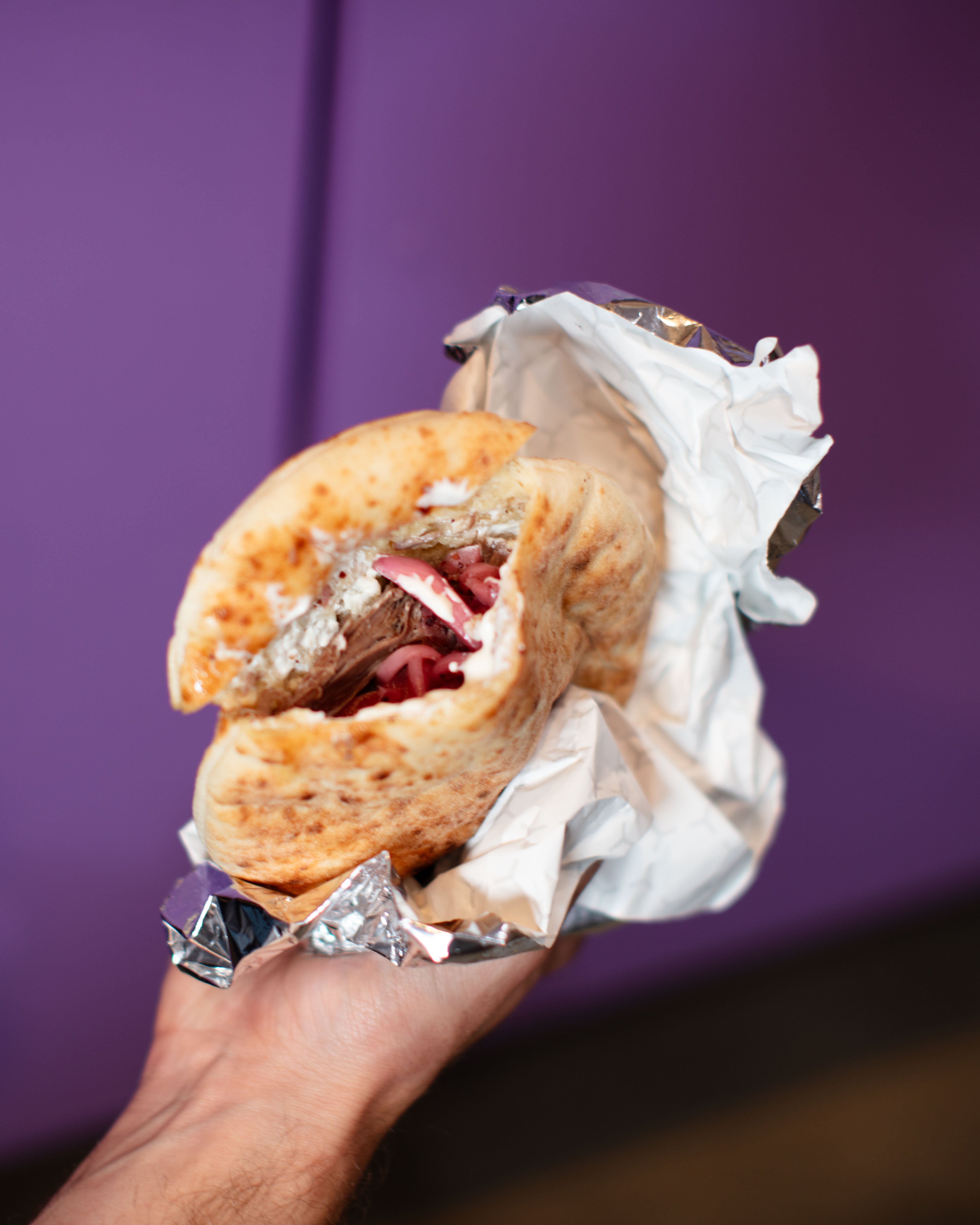 Stuffed pita with braised meat and citrus salsa