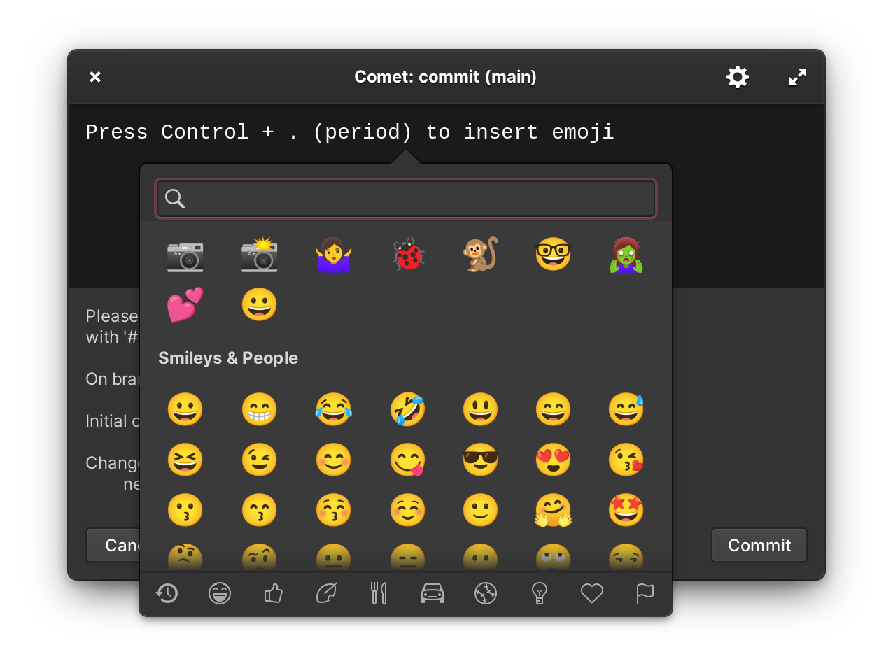 Screenshot of editor with the message “Press Control + . (period) to insert emoji” and the emoji picker popover showing. The Git comment for an initial commit with a new file called a.txt to be committed is partially visible in a separate area. There is a Cancel button (partially visible) and a Commit button on the window.