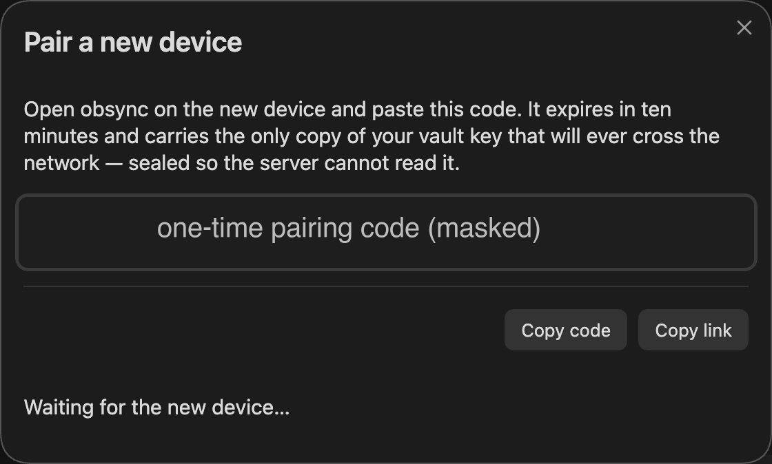 The Pair a new device dialog on the first device, its one-time code obscured