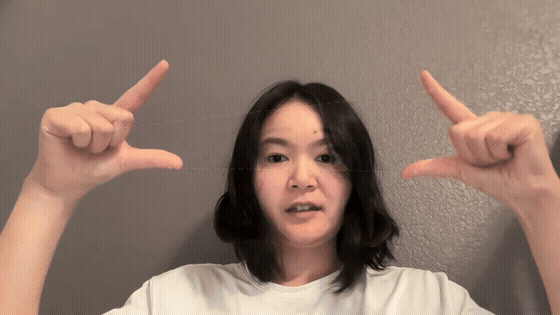 示例:手指取景框内的 AI 动画世界