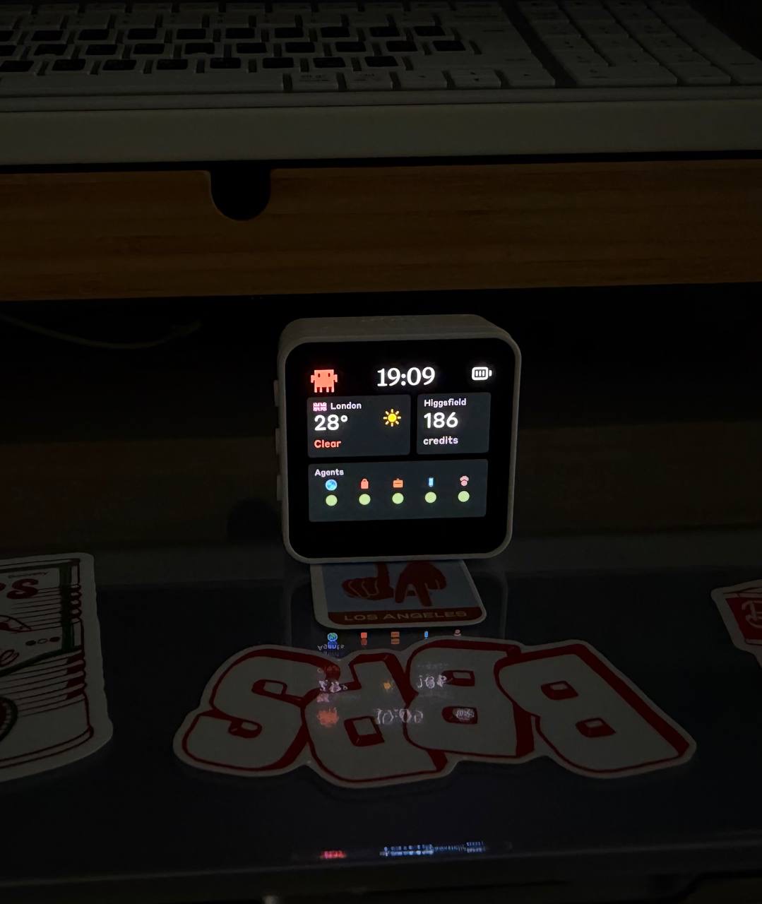 Clawdmeter on a desk showing the status screen