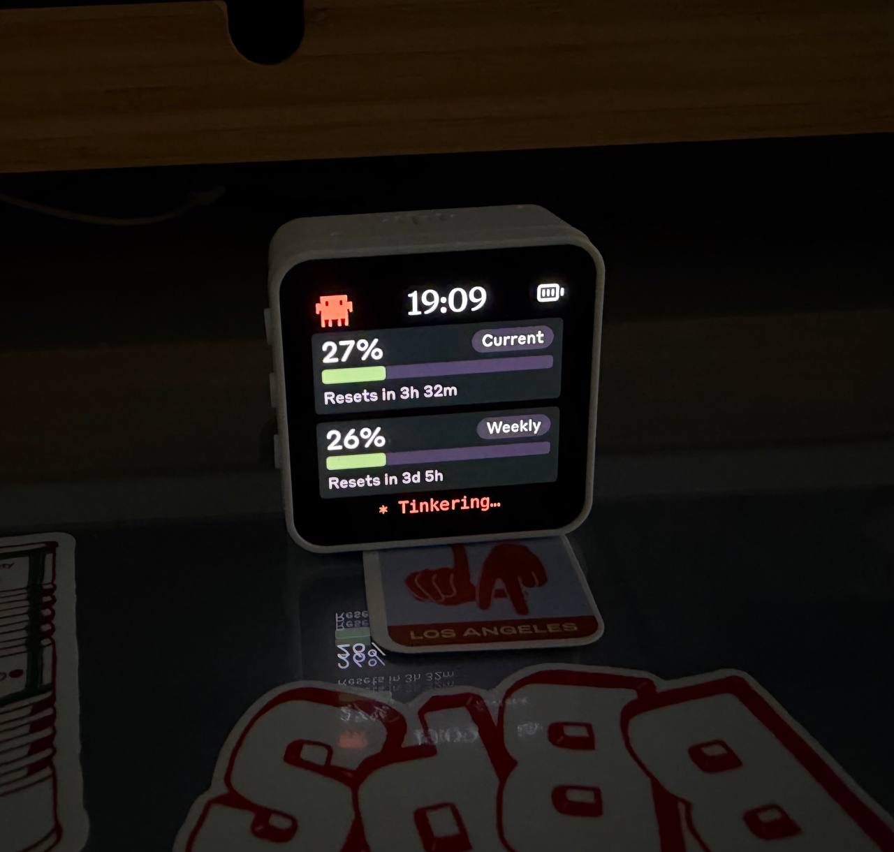 Clawdmeter on a desk showing the usage screen