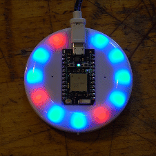 Gif of internet button illuminating LEDs in sequence in blue or red.