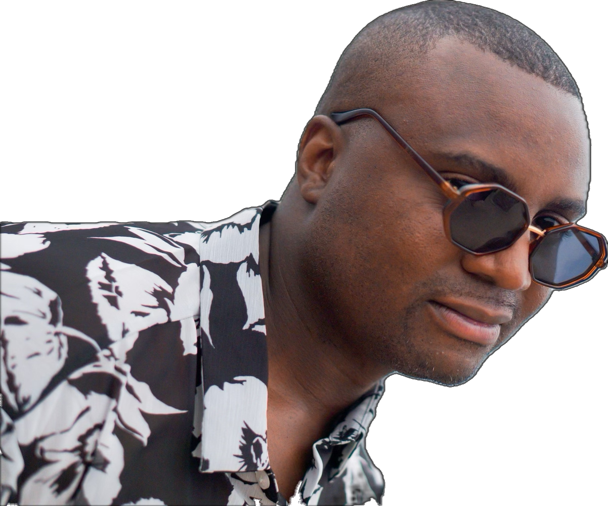 Steve Ryan wearing sunglasses and a black-and-white floral shirt