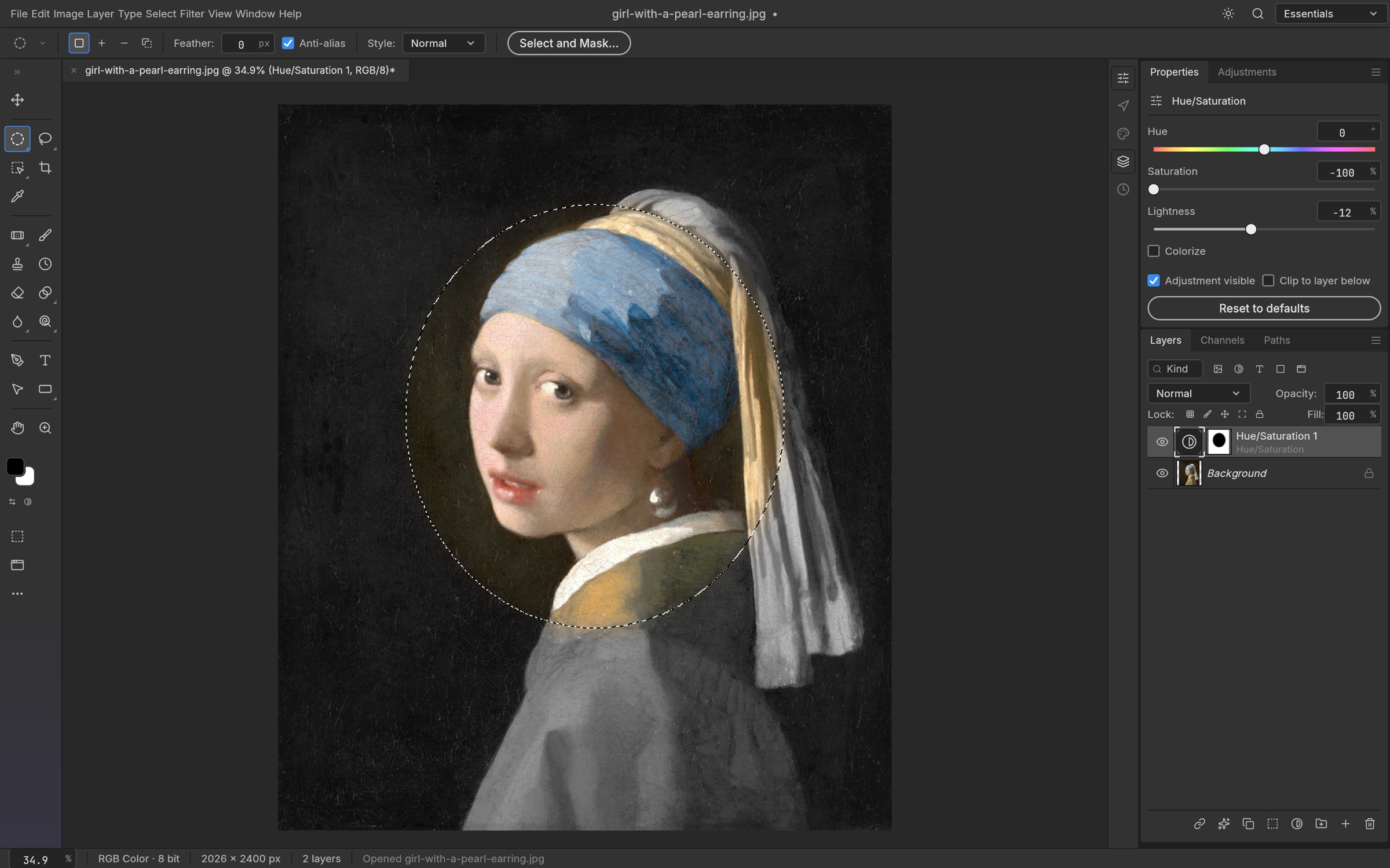 A feathered elliptical selection used as the mask of a Hue/Saturation layer