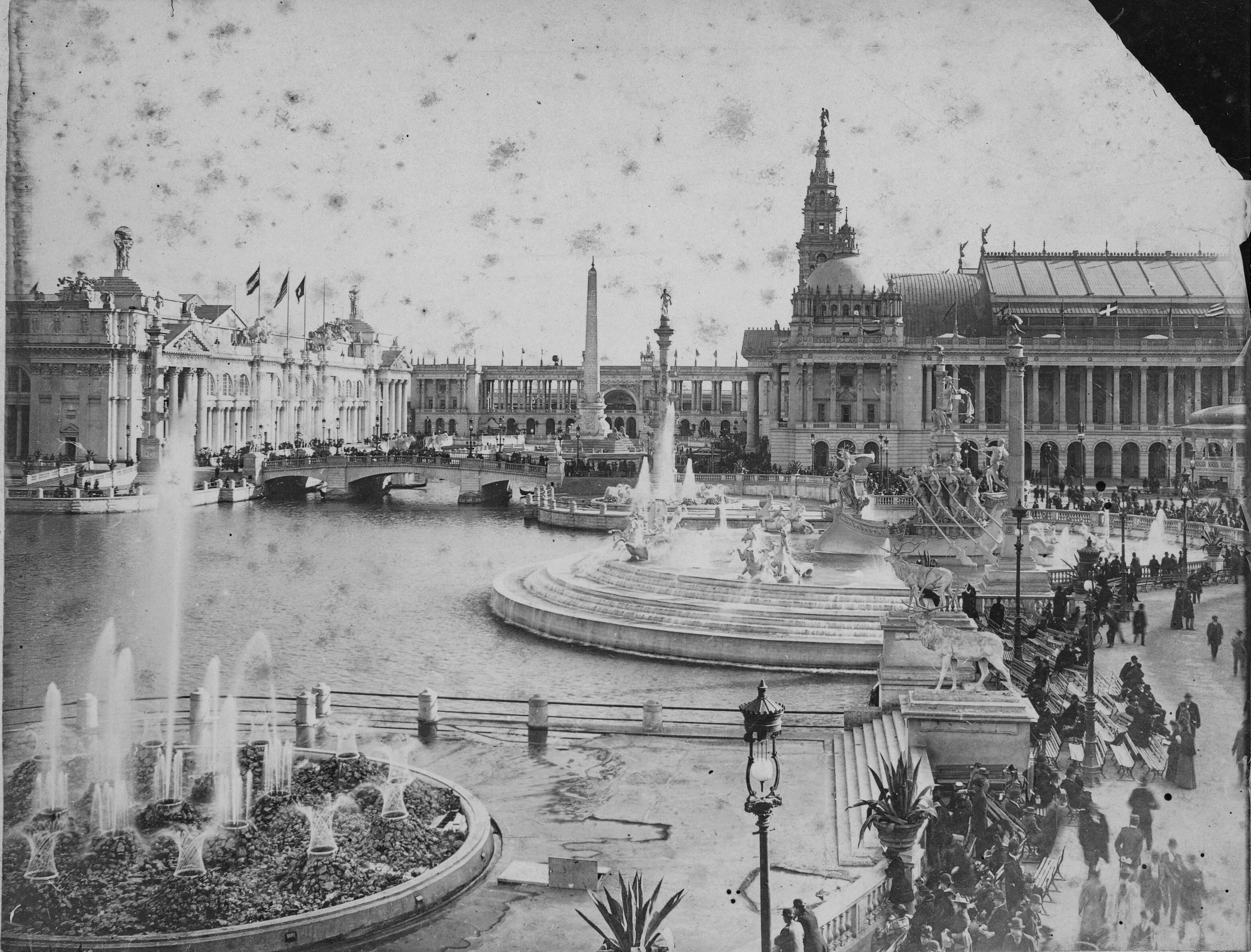 Black and White Photograph of a Grand Architectural Complex and Fountains by a Waterway (1893)