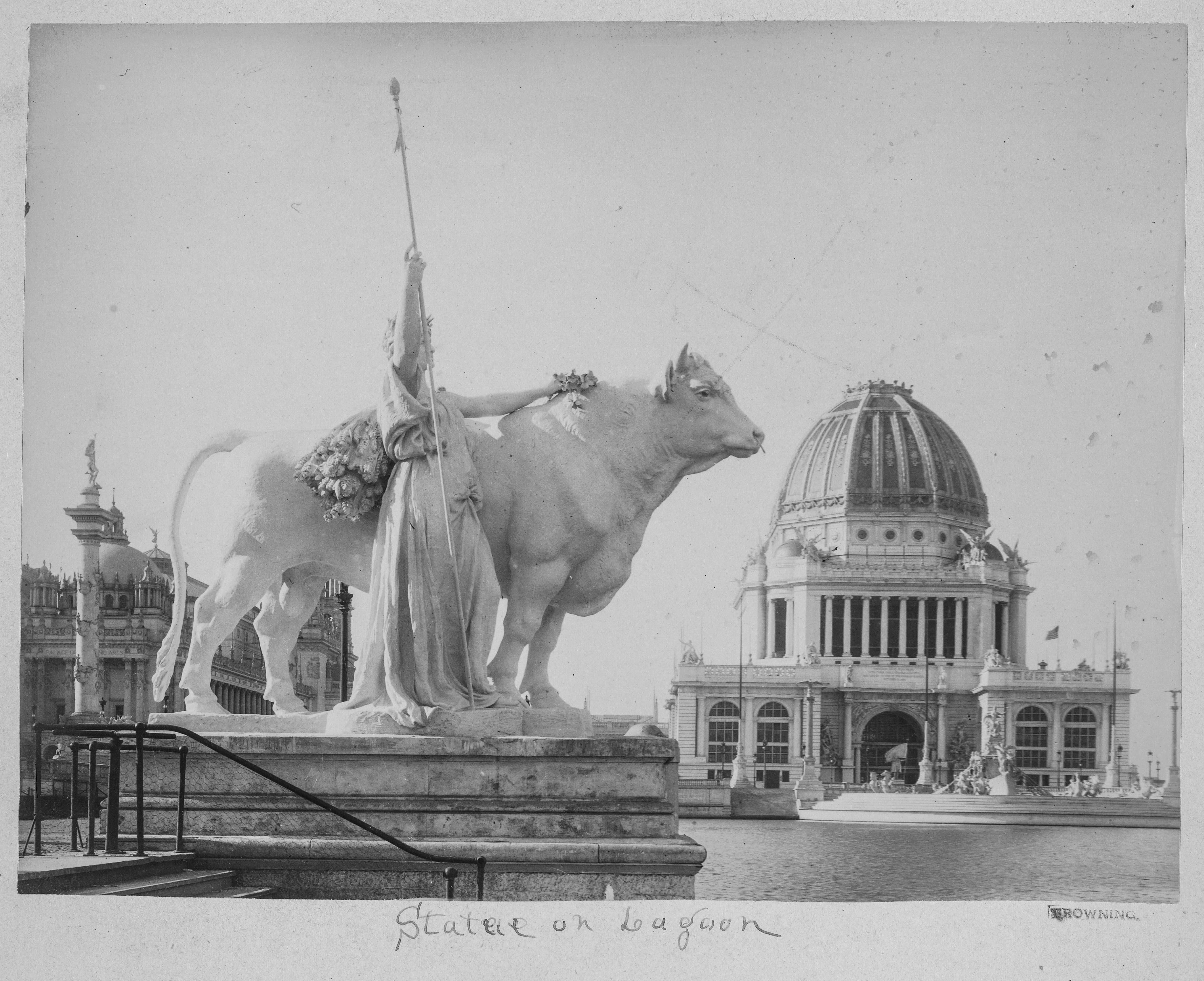 Statue of a Draped Female Figure and a Bull on a Lagoon at a Classical Exposition (1893)