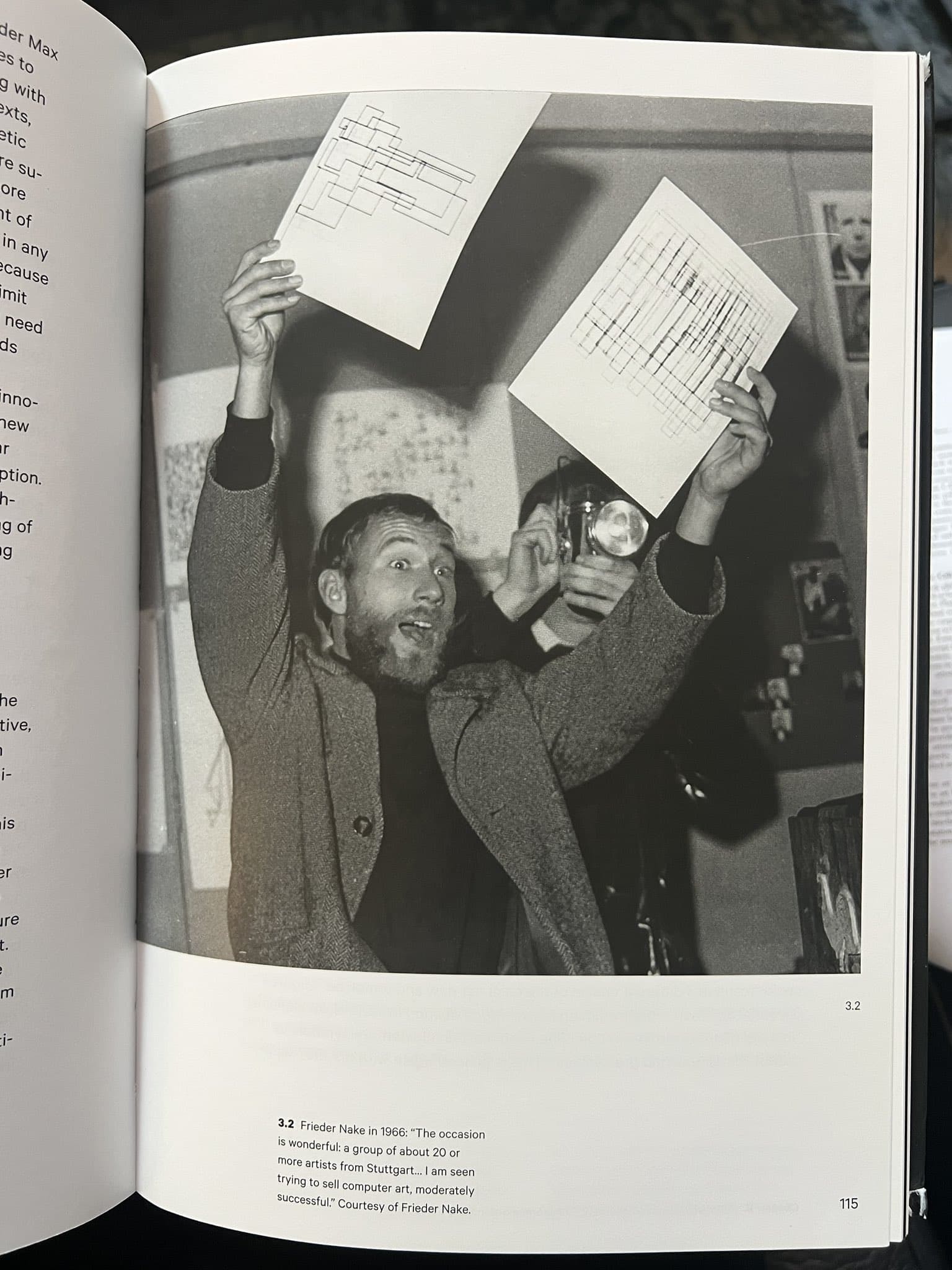 Black and White Photograph of Frieder Nake Holding Two Computer-Generated Drawings (1966)
