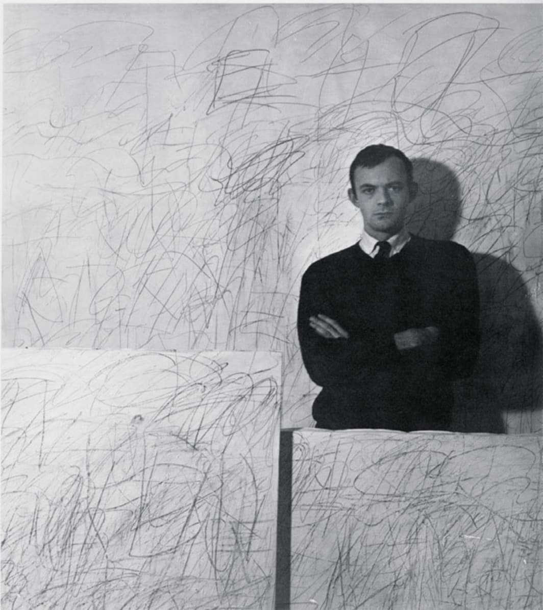 Cy Twombly posed with early scribble paintings (late 1950s)