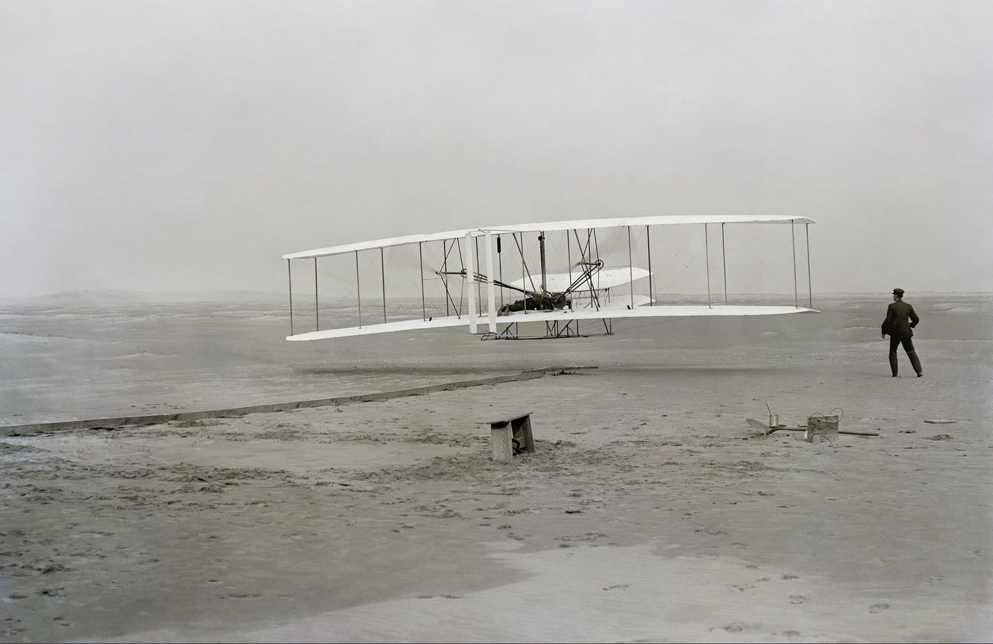 First flight, 120 feet in 12 seconds, 10:35 a.m.; Kitty Hawk, North Carolina by John T. Daniels (1903)