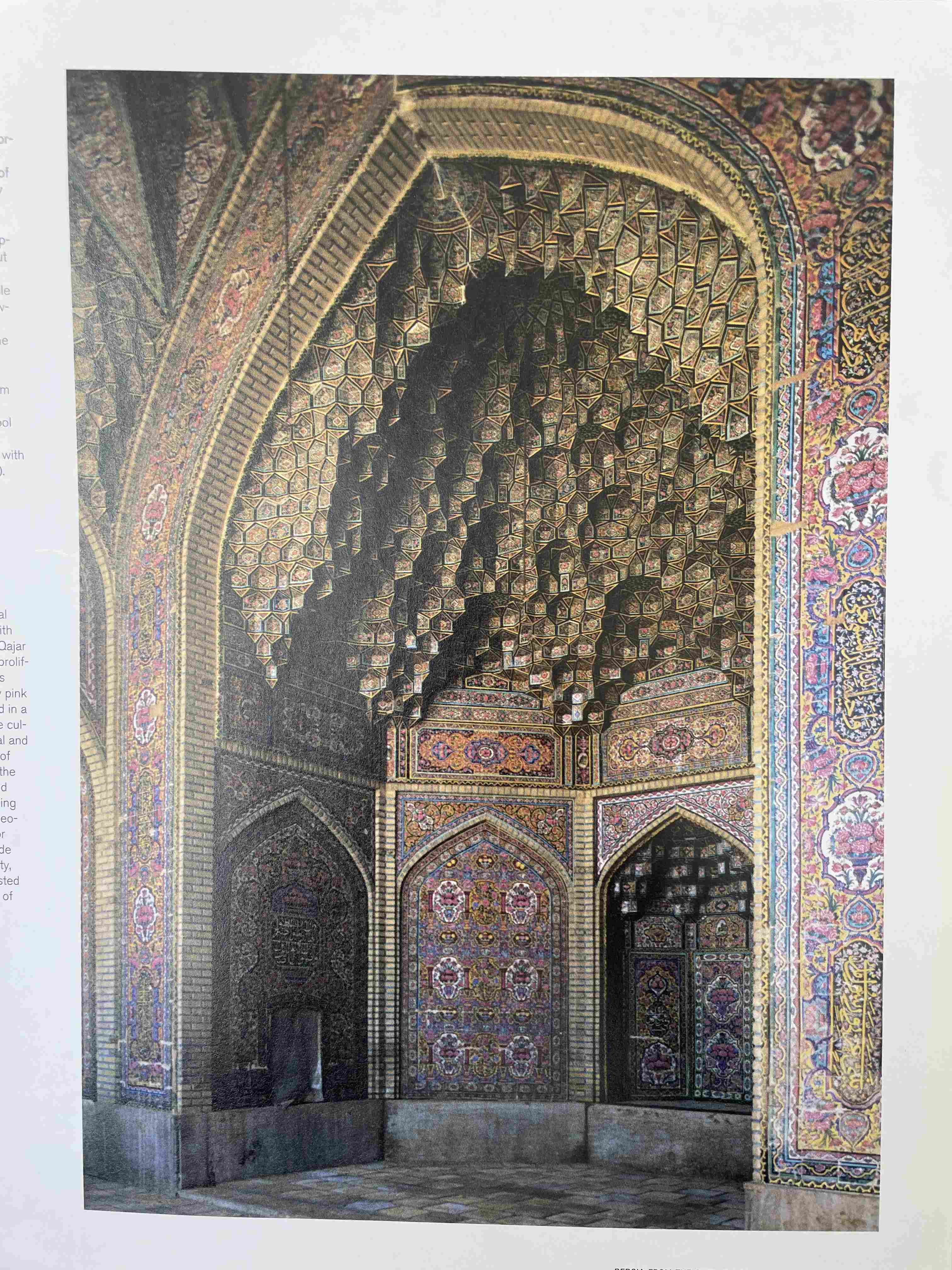Interior View of an Archway with Muqarnas and Colorful Tile Decoration