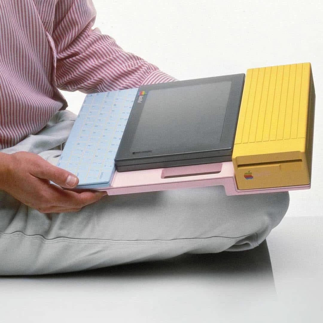 Photograph of a person holding a colorful modular computer prototype