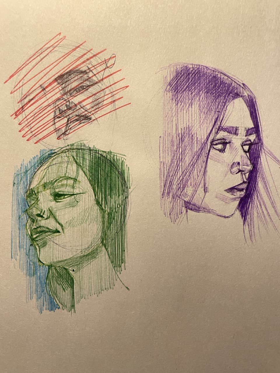 Multi-colored Pen Sketches of Three Faces on Tan Paper
