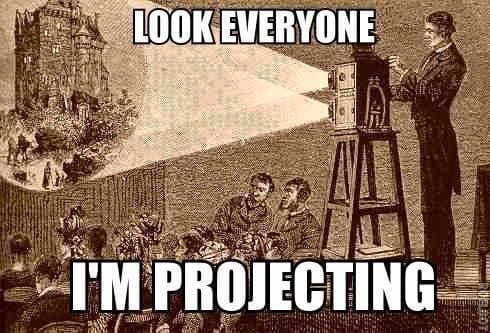 Engraving of a man operating a projector to display a castle image to an audience