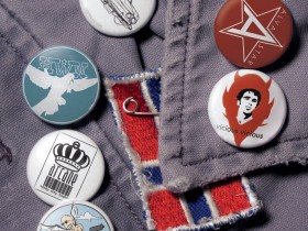 Buttons of various band logos created while at 2024 records