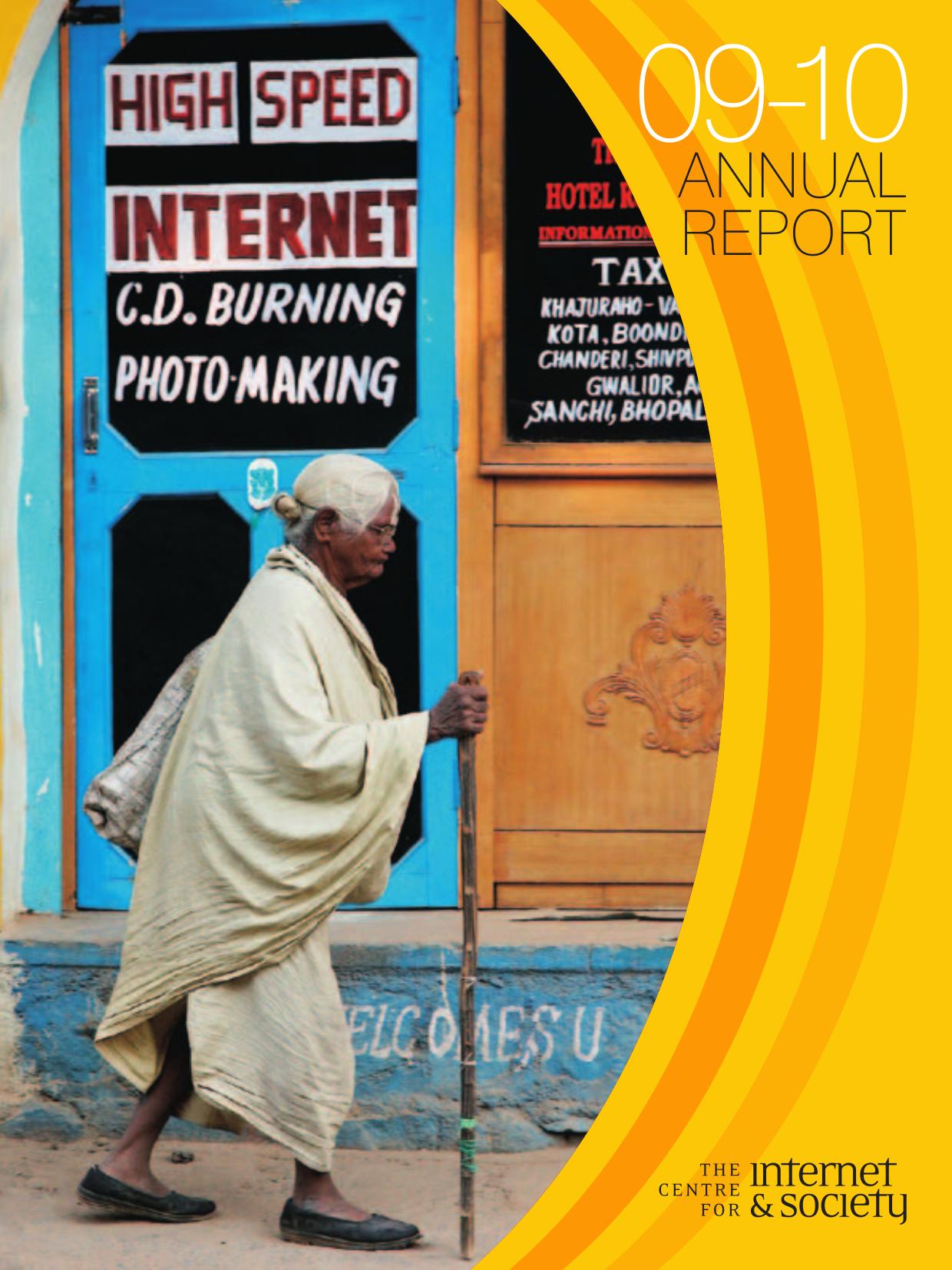 Front cover of the Centre for Internet and Society Annual Report 2009–10, featuring a photograph by Michael Greenwood of an elderly man walking past a shop advertising high-speed internet, CD burning, and photo-making services.