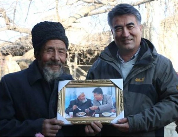 "Tashpolat Tiyip with a farmer who he met through his fieldwork in rural desert locations"