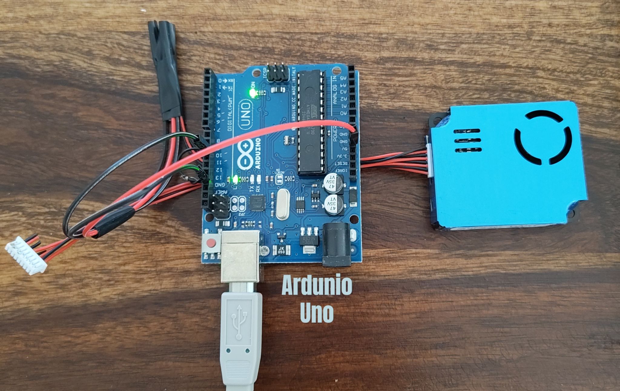 Arduino Uno with PM2.5 sensor setup for air quality monitoring