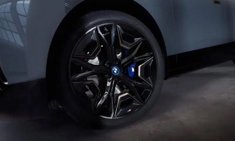 Original BMW brakes visible behind an M alloy wheel